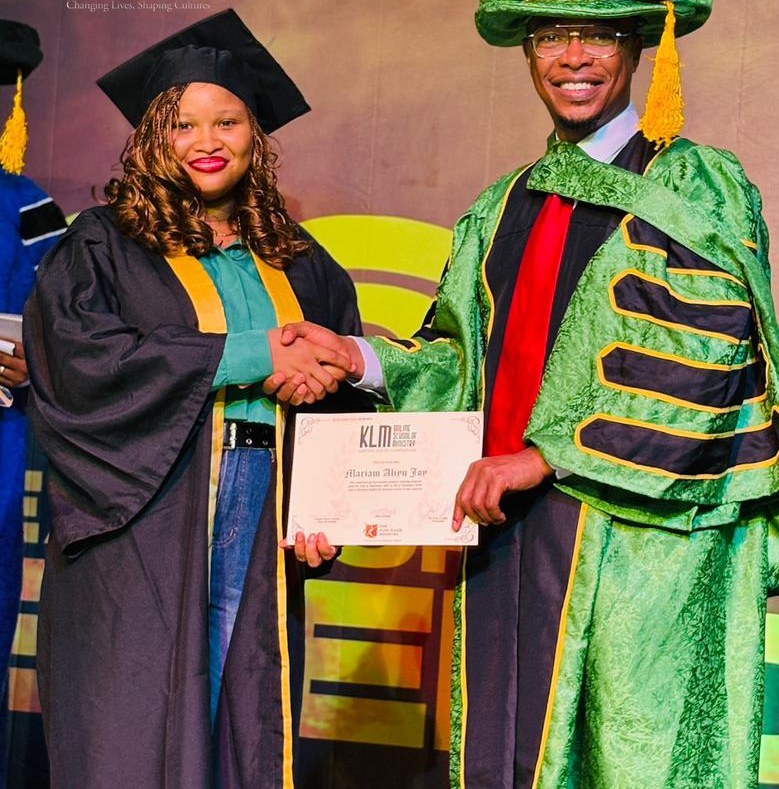 Mariam Abru Joy receiving a Certificate of Completion at Camp Meeting 2026